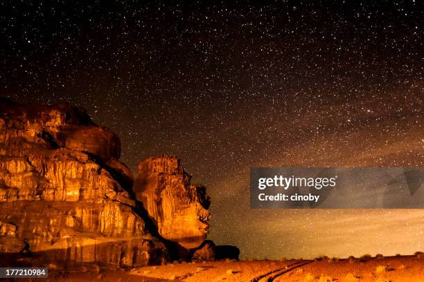 starry sky on desert of wadi rum - jorden stock pictures, royalty-free photos & images
