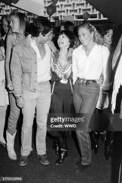 Chad McQueen, Neile Adams, and Terry McQueen attend an event at the Santa Monica Civic Auditorium in Santa Monica, California, on May 11, 1982.