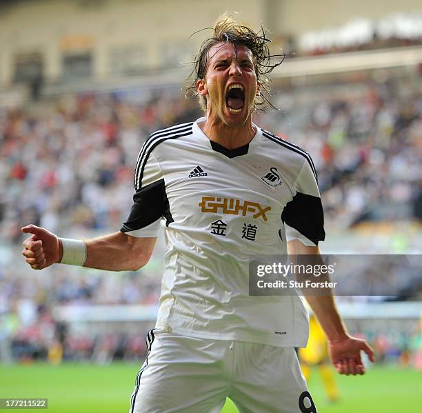 Swansea player Michu celebrates after scoring the second swansea goal during the UEFA Europa League play-off first leg between Swansea City and FC...