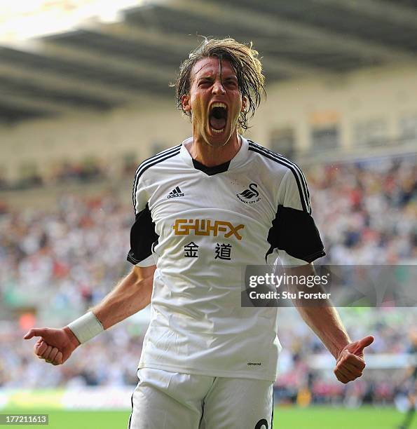Swansea player Michu celebrates after scoring the second swansea goal during the UEFA Europa League play-off first leg between Swansea City and FC...