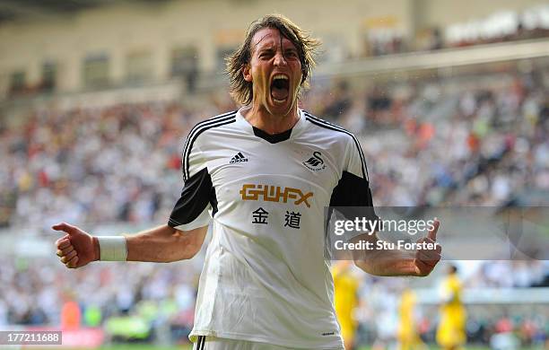 Swansea player Michu celebrates after scoring the second swansea goal during the UEFA Europa League play-off first leg between Swansea City and FC...