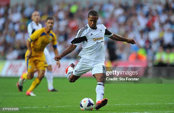 Swansea player Wayne Routledge gets in a shot at goal during the UEFA Europa League play-off first leg between Swansea City and FC Petrolul Ploiesti...