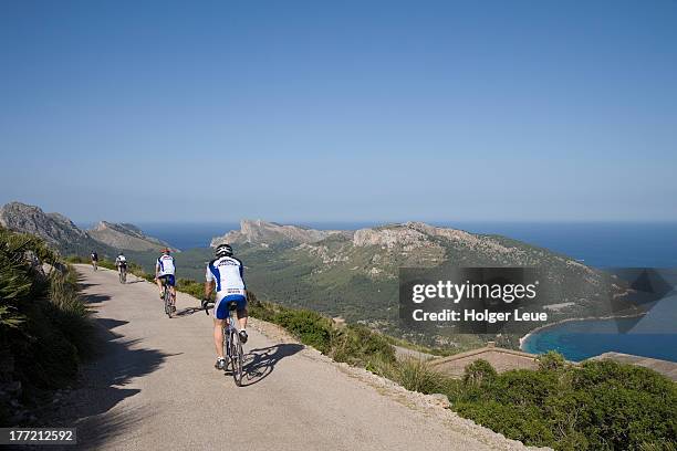 cyclists near cap de formentor - cabo formentor stock pictures, royalty-free photos & images