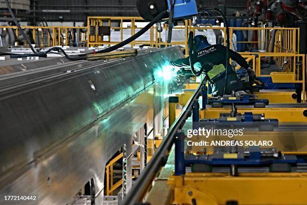Welder works on a new hybrid tri-mode train 'Masaccio' built by Hitachi and renamed "Blues" by italian railway company Trenitalia, at the factory in...