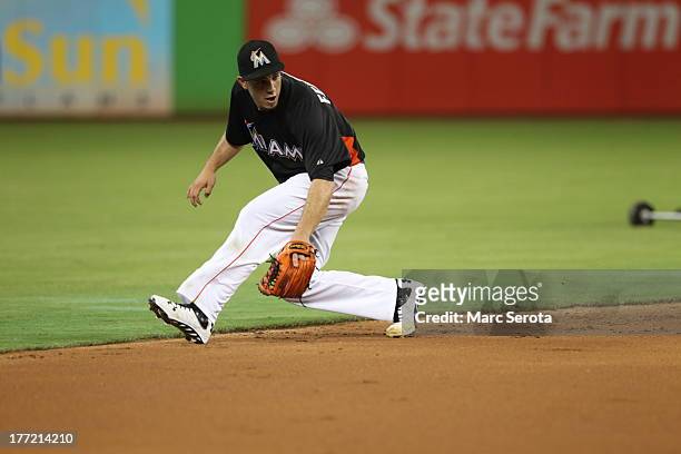 Rookie Pitcher Jose Fernandez of the Miami Marlins fields ground balls during batting practice prior to playing against the San Francisco Giants at...