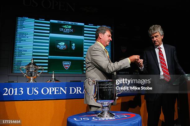 David A. Haggerty, Chairman of the Board, CEO and President of the USTA and Brian Earley, U.S. Open Referee, participate in the Draw Ceremony prior...