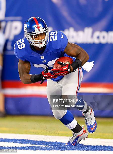Michael Cox of the New York Giants in action against the Indianapolis Colts during their preseason game on August 18, 2013 at MetLife Stadium in East...