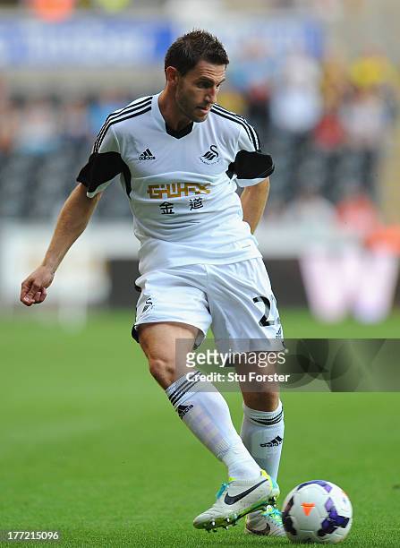 Swansea player Angel Rangel in action during the UEFA Europa League play-off first leg between Swansea City and FC Petrolul Ploiesti at Liberty...