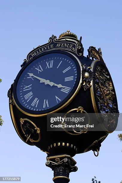 a clock on bellevue avenue - newport rhode island stock pictures, royalty-free photos & images