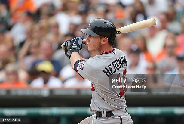 Chris Herrmann of the Minnesota Twins doubles to right center field scoring Doug Bernier during the eighth inning of the game against the Detroit...