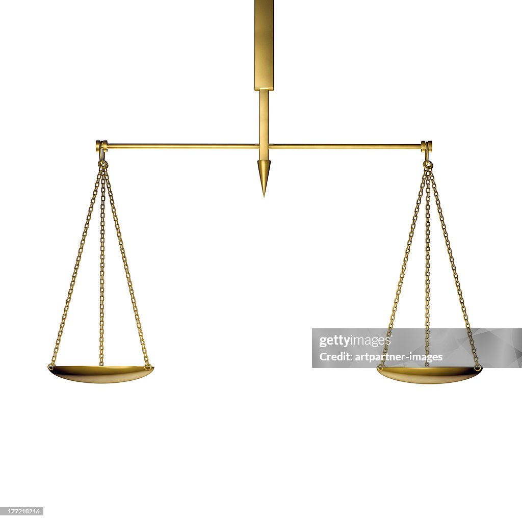 A golden scale in balance on white