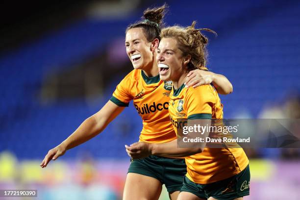 Maya Stewart and Cecilia Smith of Australia celebrate victory in the WXV1 match between Australia Wallaroos and Wales at Go Media Stadium Mt Smart on...