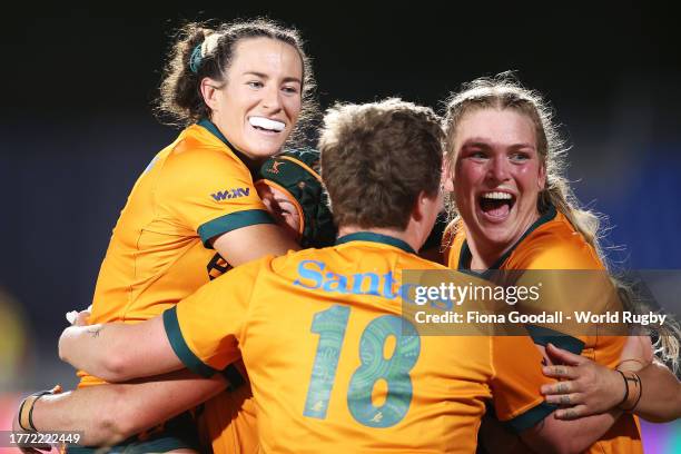 Maya Stewart, Emily Chancellor, Bridie O'Gorman and Kaitlan Leaney of Australia celebrates victory during the WXV1 match between Australia Wallaroos...