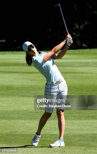 Michelle Wie hits her third shot on the 14th hole during the CN Canadian Women's Open at Royal Mayfair Golf Club on August 22, 2013 in Edmonton,...