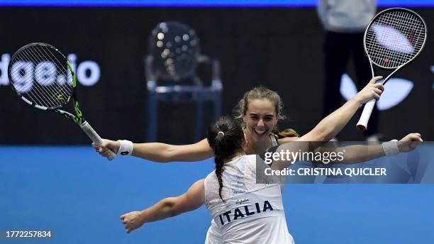 Italy's Lucia Bronzetti and Elisabetta Cocciaretto celebrate beating Germany's Anna-Lena Friedsam and Laura Siegemund during the group stage group D...