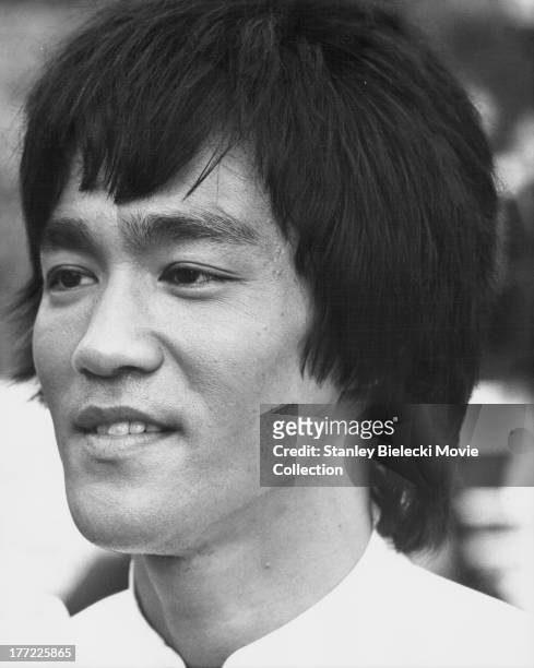 Promotional headshot of actor Bruce Lee, as he appears in the movie 'Enter the Dragon', 1973.