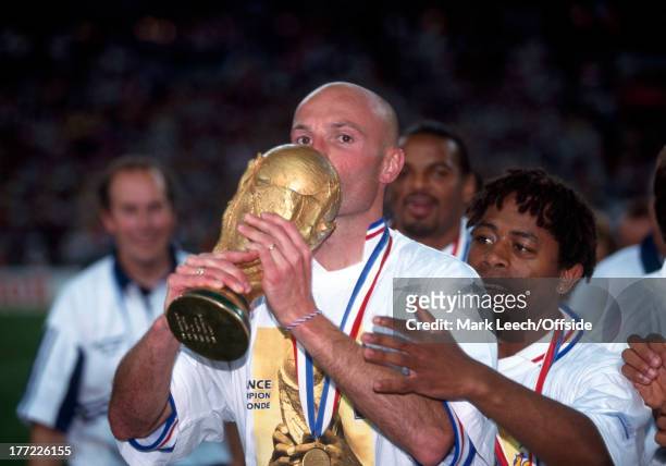 Football World Cup 1998, France v Brazil, Frank LeBoeuf kisses the World Cup trophy after the French victory.