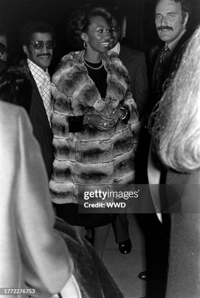 Sammy Davis Jr. And Altovise Davis attend a charity auction at the Cocoanut Grove nightclub in Los Angeles, California, on April 5, 1975.