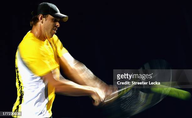 Sam Querrey of the USA returns a shot to Ricardas Berankis of Lithuania in the quarterfinals match during day 5 of the Winston-Salem Open at Wake...