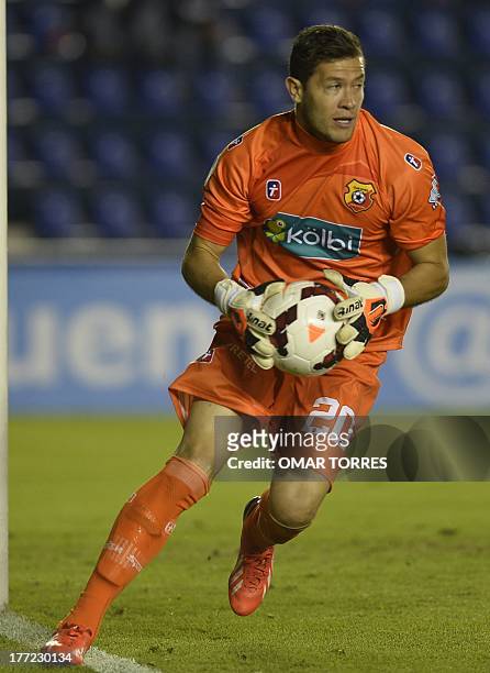 Daniel Cambronero, goalkeeper of Costa Rican Herediano, catches the ball during the Concachampions group stage football match againts Cruz Azul on...