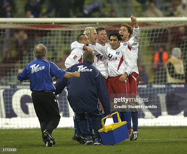 The Hamburg players and staff celebrate after claiming a draw in the Bundesliga match between Bayern Munich and Hamburg SV played at the...