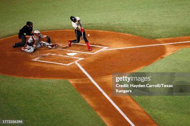 Adolis Garcia of the Texas Rangers hits a home run during a game against the Minnesota Twins at Globe Life Field on September 02, 2023 in Arlington,...