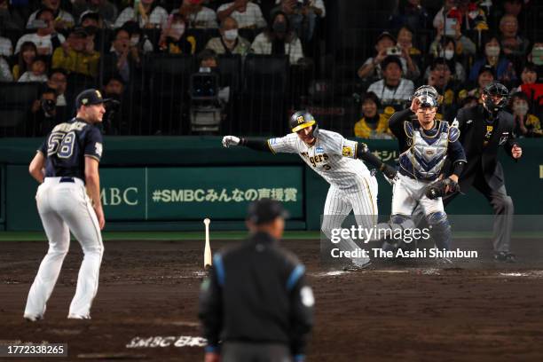 Yusuke Oyama of the Hanshin Tigers hits a game-ending single in the 9th inning against Orix Buffaloes during the Japan Series Game Four at Hanshin...