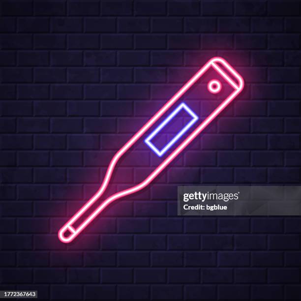 medical thermometer. glowing neon icon on brick wall background - measuring wall stock illustrations