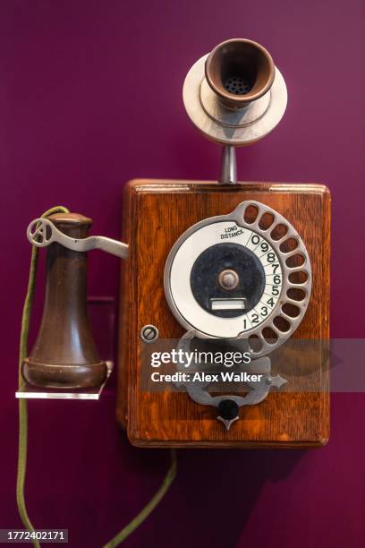 vintage telephone on coloured background. - communication occupation stock pictures, royalty-free photos & images