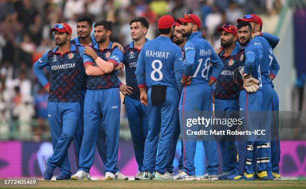 Rashid Khan of Afghanistan celebrates the wicket of Roelof van der Merwe of Netherlands which is given not out on review during the ICC Men's Cricket...