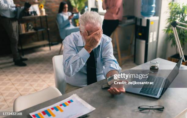 senior business man measures the pressure in the office - peripheral artery stock pictures, royalty-free photos & images