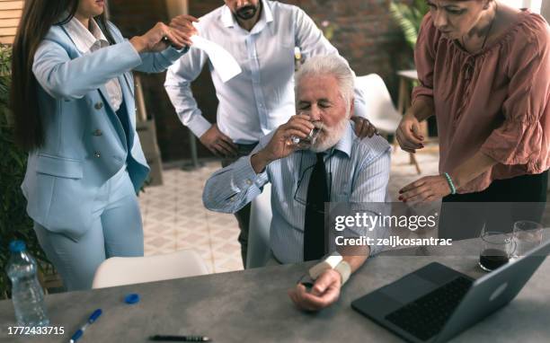 senior business man measures the pressure in the office - peripheral artery stock pictures, royalty-free photos & images