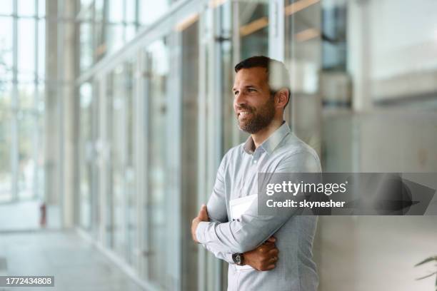 happy businessman day dreaming in the office. - business casual stock pictures, royalty-free photos & images
