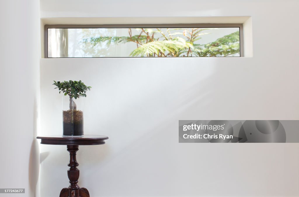 Long window above table in modern house