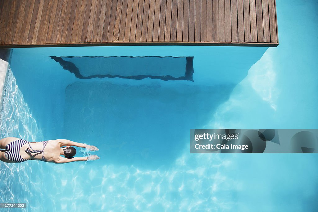 Woman in luxury swimming pool