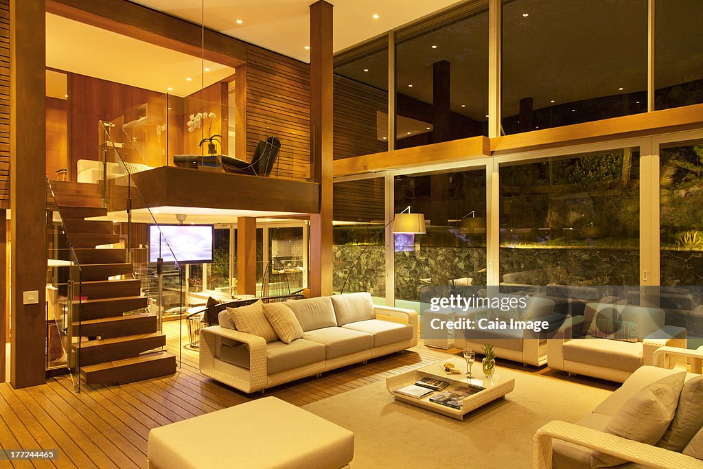 Illuminated modern living room at night