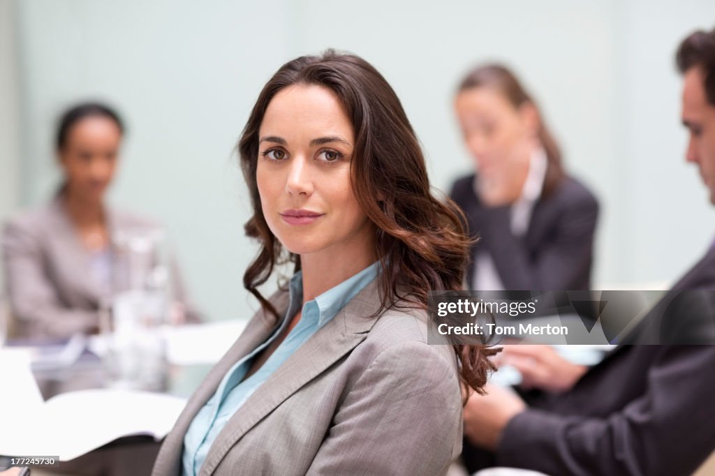 Portrait of confident businesswoman in meeting