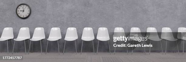 row of white empty chairs in a waiting room with a clock 3d render - clock on wall stock illustrations