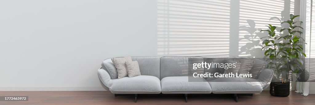 Clean wall space in living room with light blue sofa and large plant by window 3d render