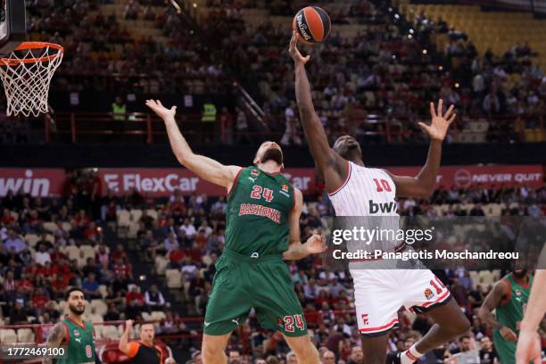 Moustapha Fall, #10 of Olympiacos Piraeus competes with Matthew Costello, #24 of Baskonia Vitoria Gasteiz during the Turkish Airlines EuroLeague...