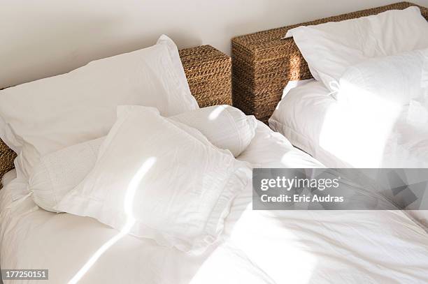 sunlight falling on a bed - letto matrimoniale foto e immagini stock