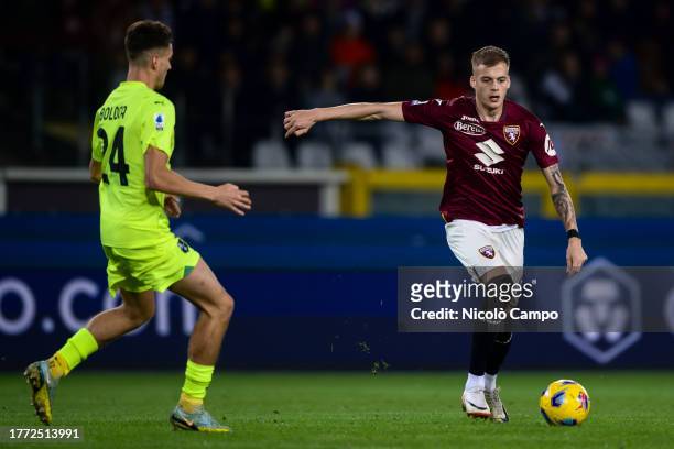 Ivan Ilic of Torino FC is challenged by Daniel Boloca of US Sassuolo during the Serie A football match between Torino FC and US Sassuolo. Torino FC...
