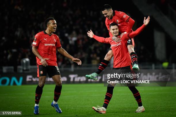 Rennes' Swiss midfielder Fabian Rieder celebrates with teammates after scoring a goal during the UEFA Europa League Group F football match between...