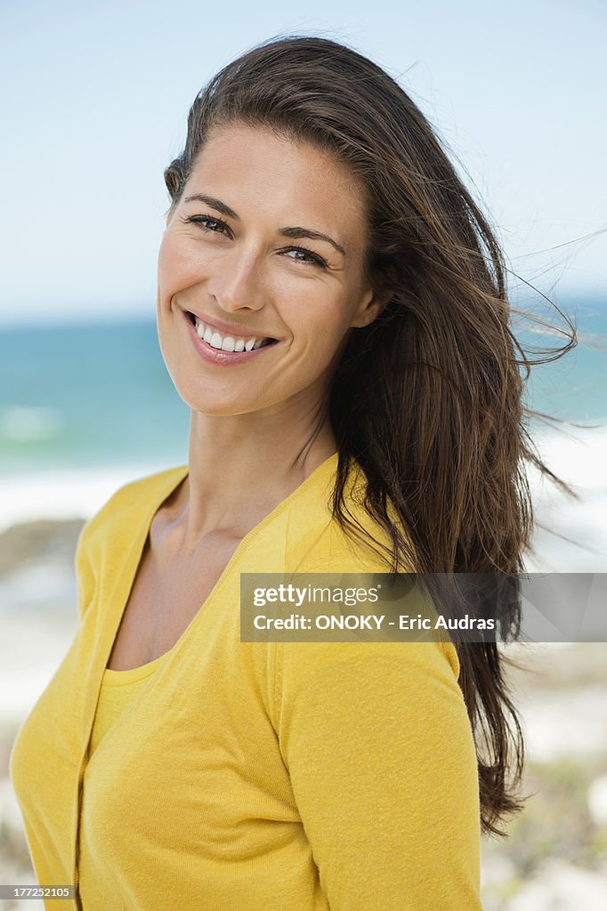 Portrait of a woman smiling on the beach