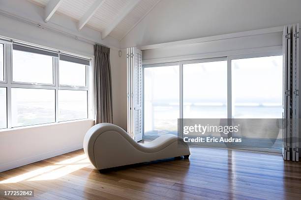 chaise longue in a room - chaise longue stock pictures, royalty-free photos & images