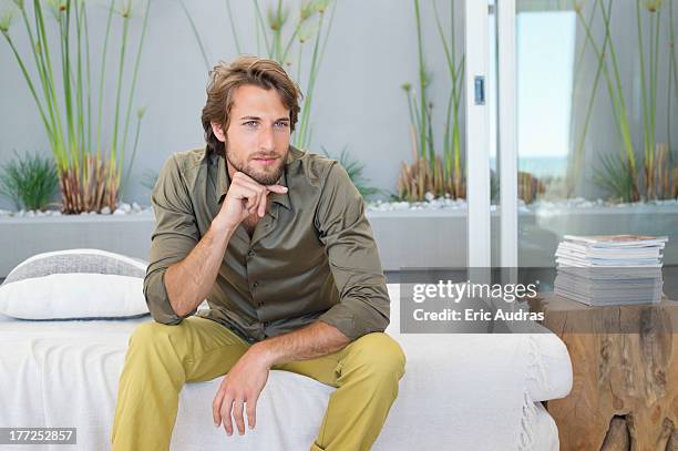 man sitting at home and thinking - leaning on elbows stock pictures, royalty-free photos & images