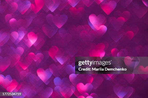 Purple neon sparkling glitter hearts bokeh lights background Purple neon sparkling glitter hearts bokeh lights background