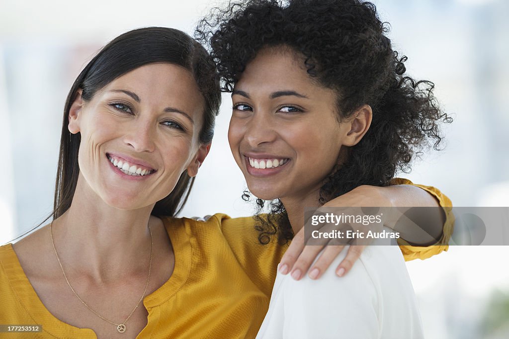 Portrait of two female friends smiling together