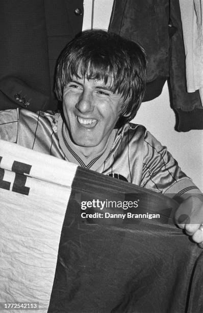 Peter Beardsley of Newcastle United celebrates in the dressing room after a 2-2 draw against Huddersfield Town at Leeds Road on May 7, 1984 which...