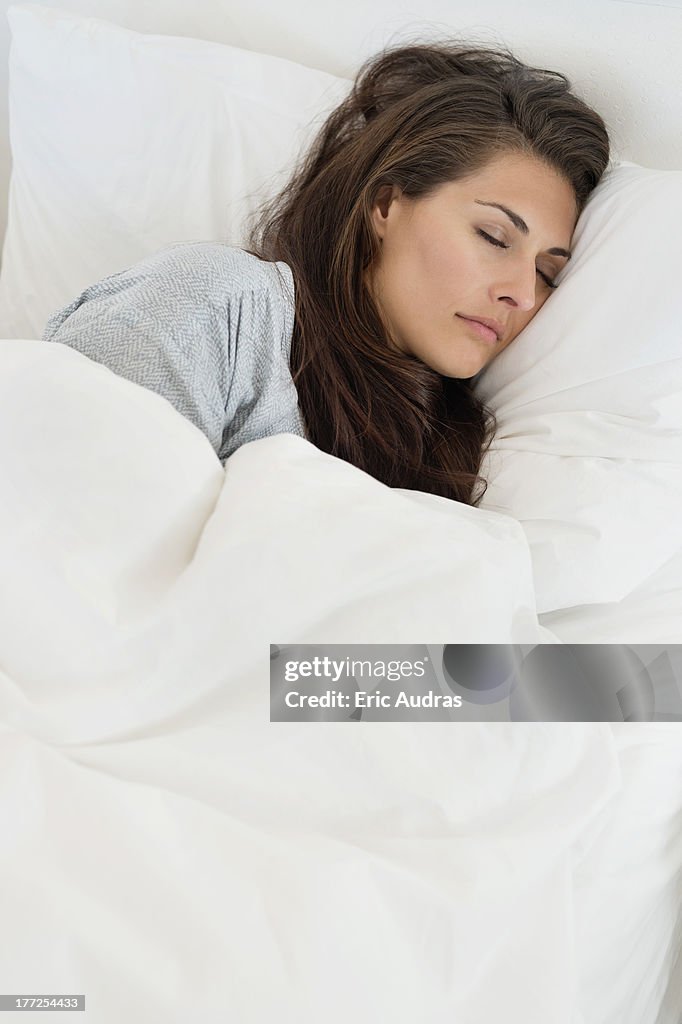 Woman sleeping on the bed